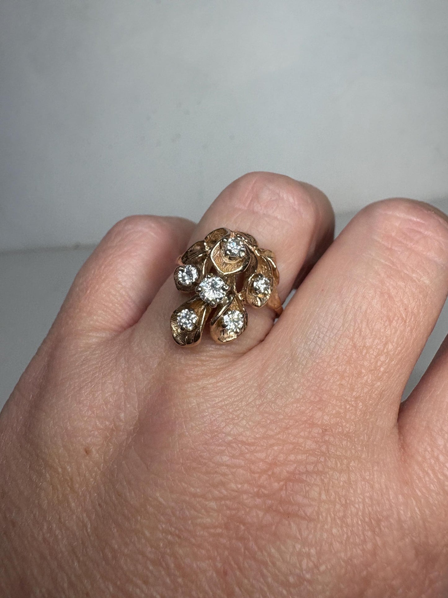Mid Century 14k gold ring with cascading floral lilies and .75ctw diamonds.
