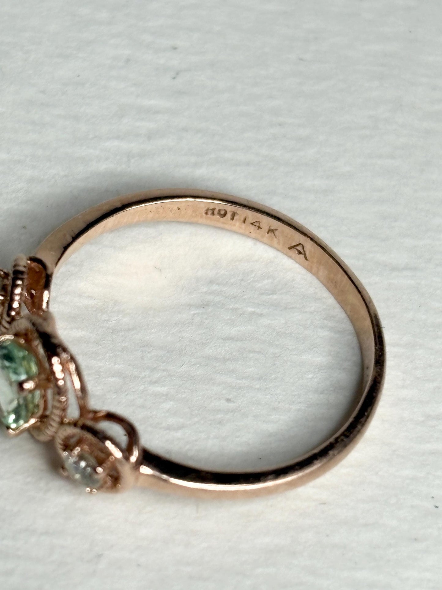 14k rose gold ring with a tourmaline and diamonds, size 6.75.