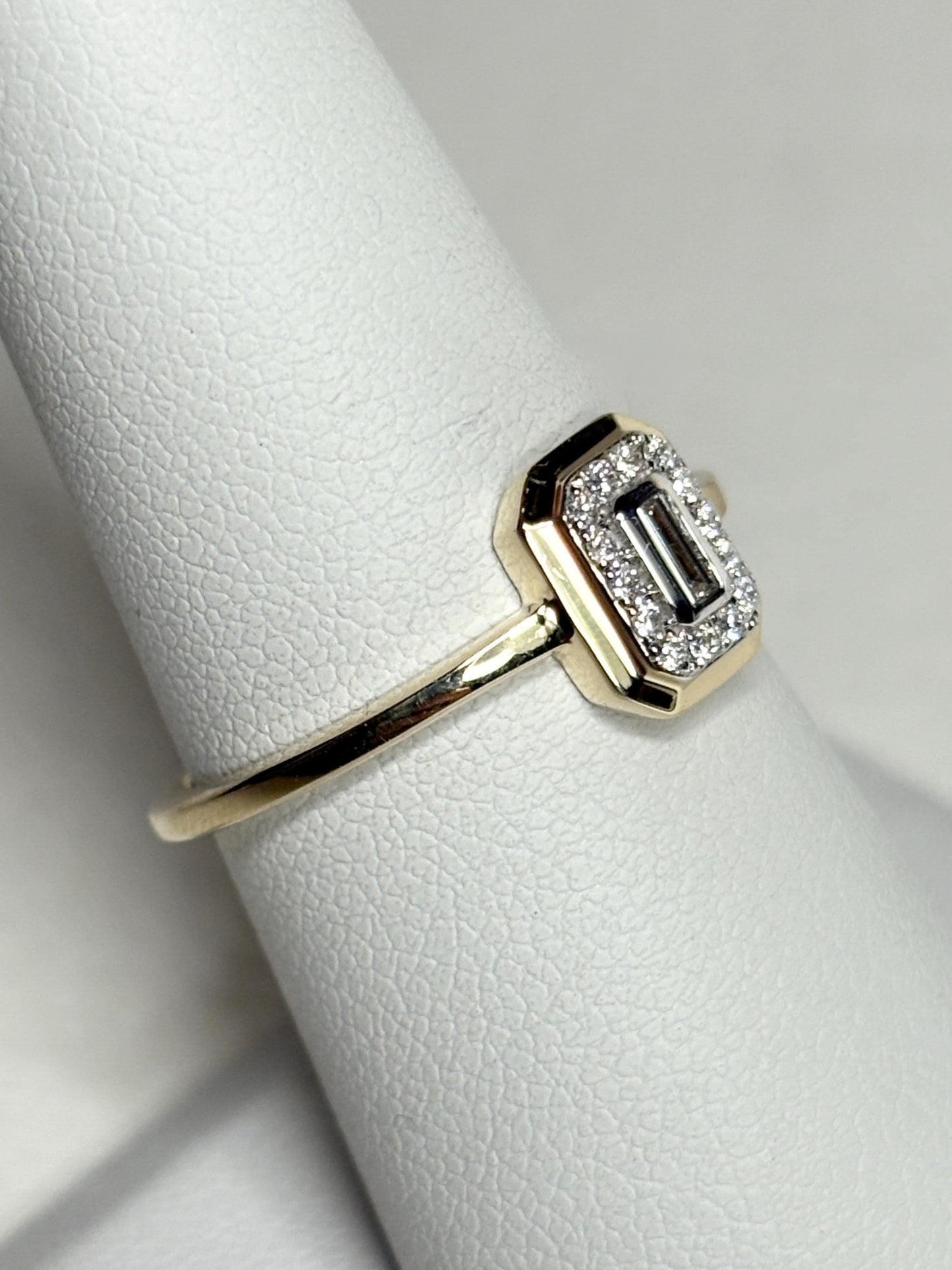 Effy 14k yellow gold ring with a baguette diamond surrounded by smaller diamonds.