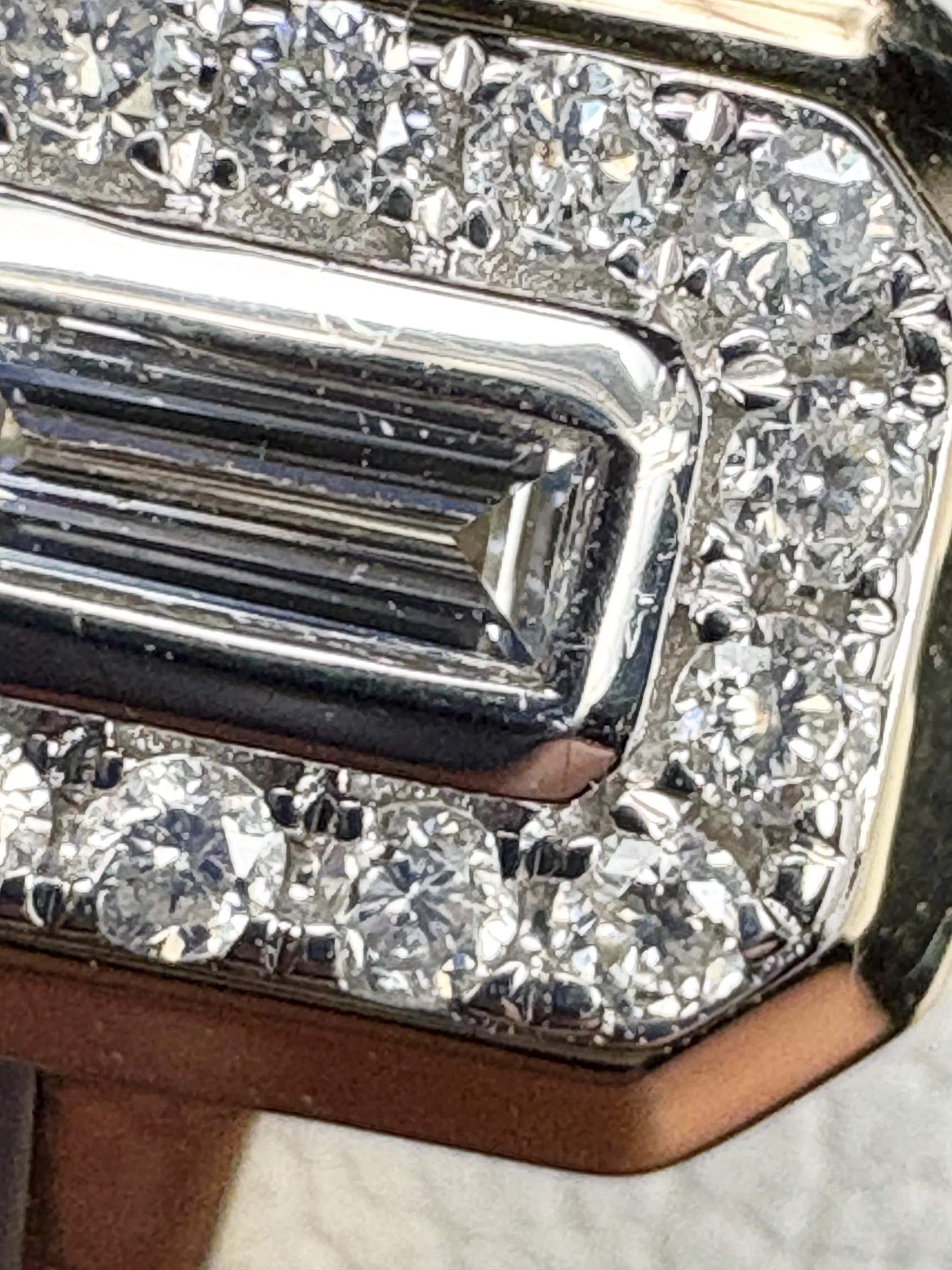 Effy 14k gold ring with a bezel-set baguette diamond surrounded by smaller diamonds.