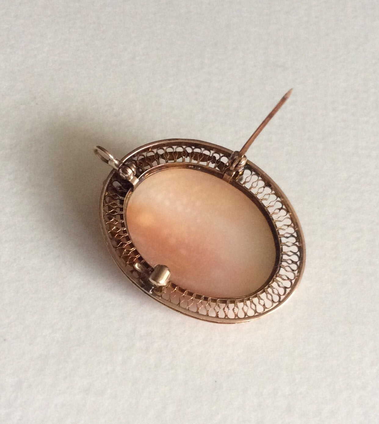 Victorian 10k gold cameo brooch pendant with shell and seed pearls.