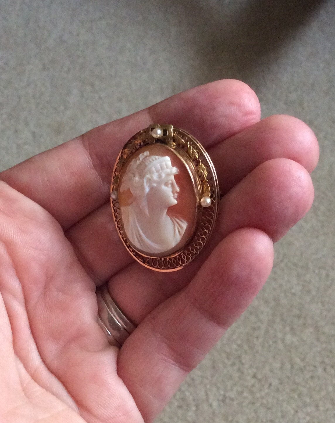 Victorian 10k gold cameo brooch pendant with shell carving and seed pearls.