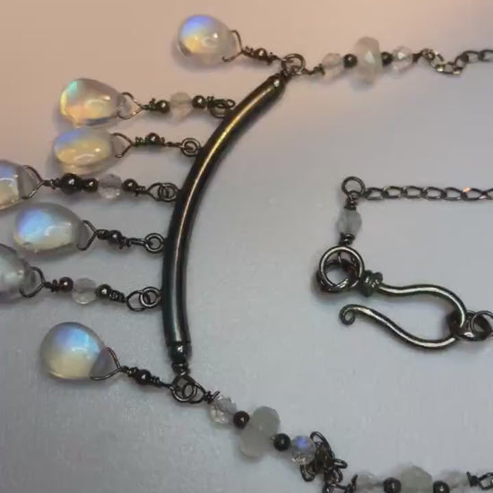 Rainbow blue sheen moonstone sterling silver wire wrapped necklace in black finish