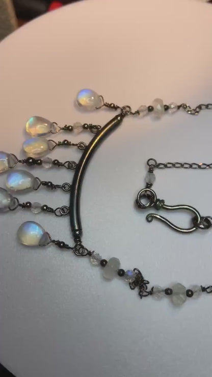 Rainbow blue sheen moonstone sterling silver wire wrapped necklace in black finish